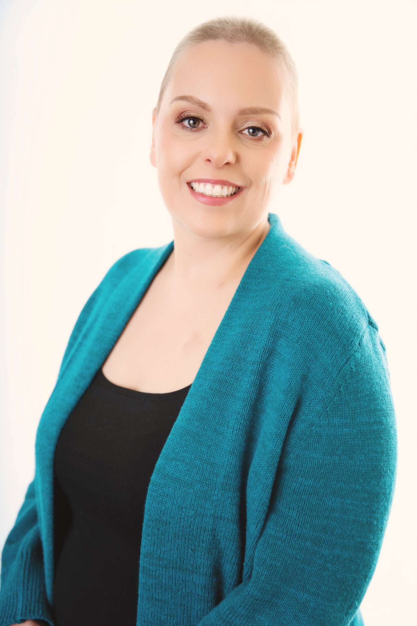 Nicole Martin, co-owner of Belle Mode Intimates, in a teal sweater